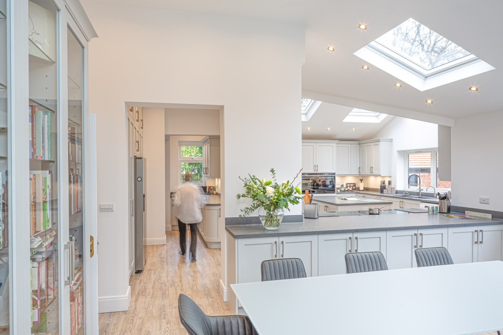 Kitchen design in white and grey work tops.